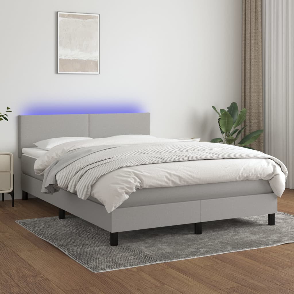 Boxspring met matras en LED stof lichtgrijs 140x200 cm